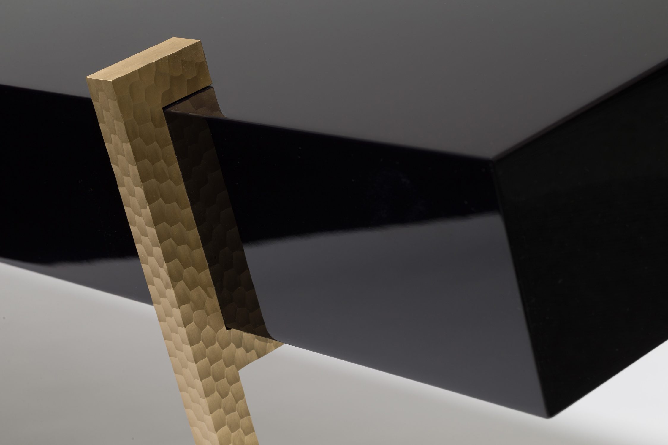 lacquer console table with worked brass legs detail