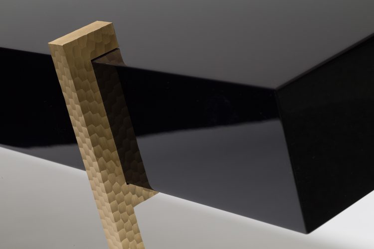 lacquer console table with worked brass legs detail
