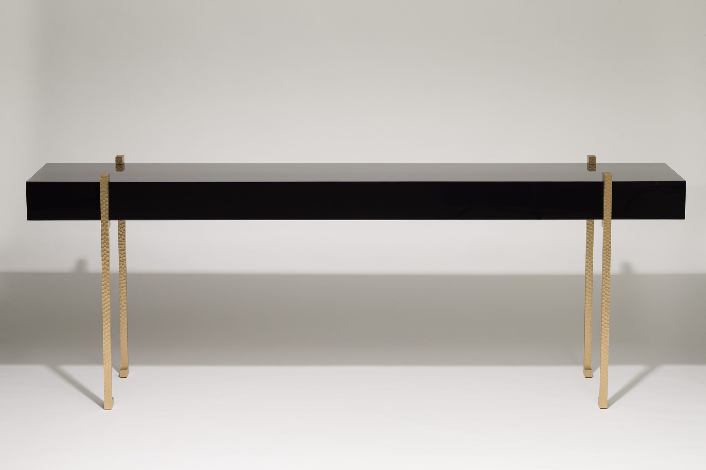 lacquer console table with worked brass legs 1