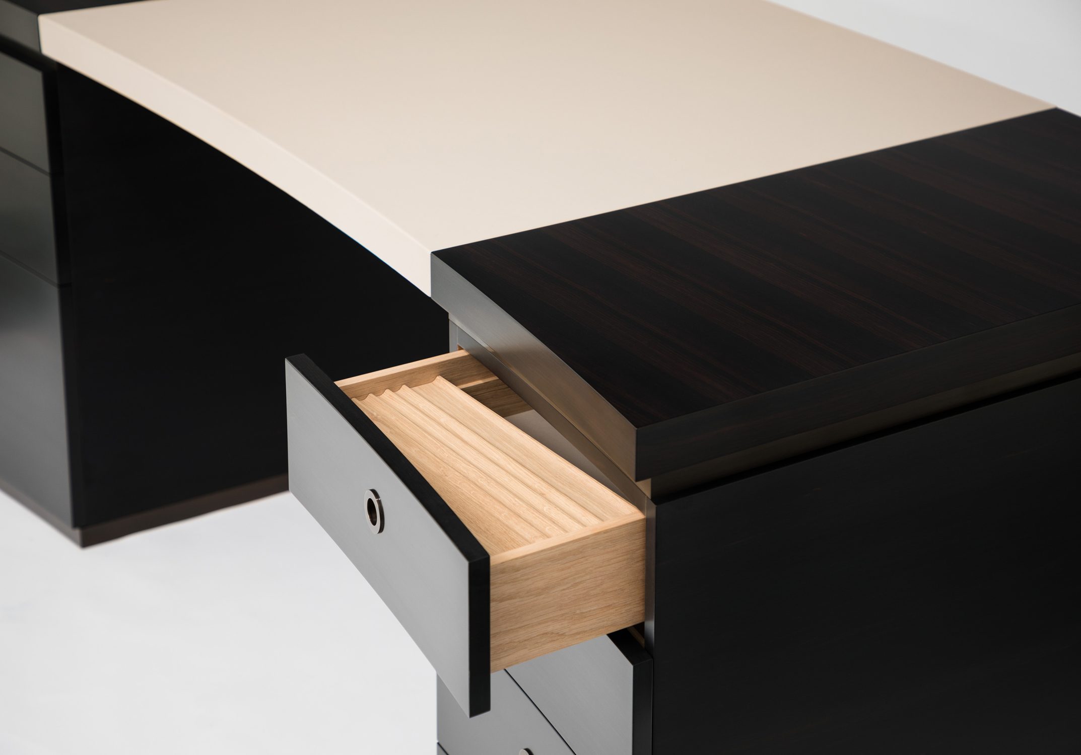curved ebony and leather desk detail 1