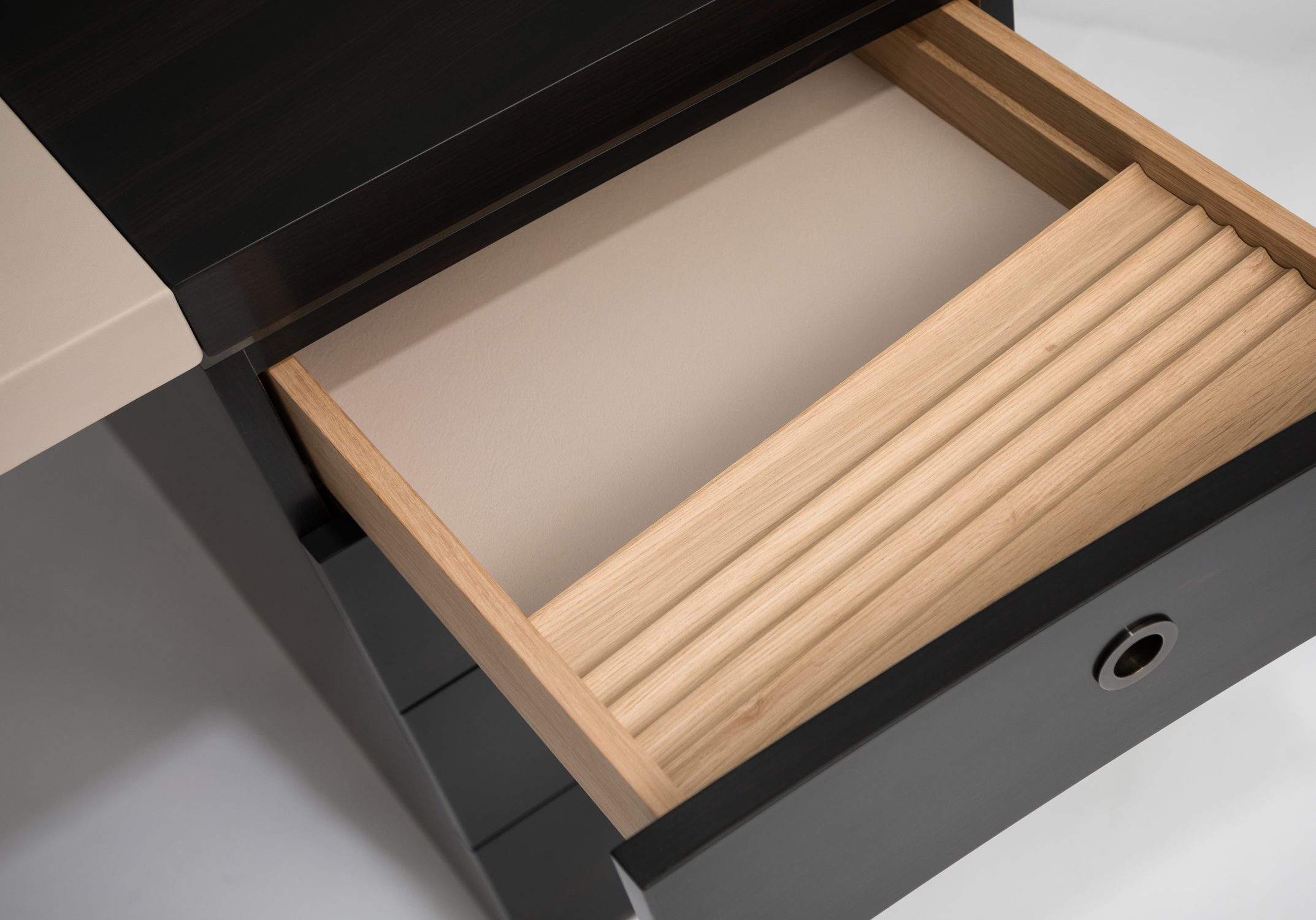 curved ebony and leather desk detail 2